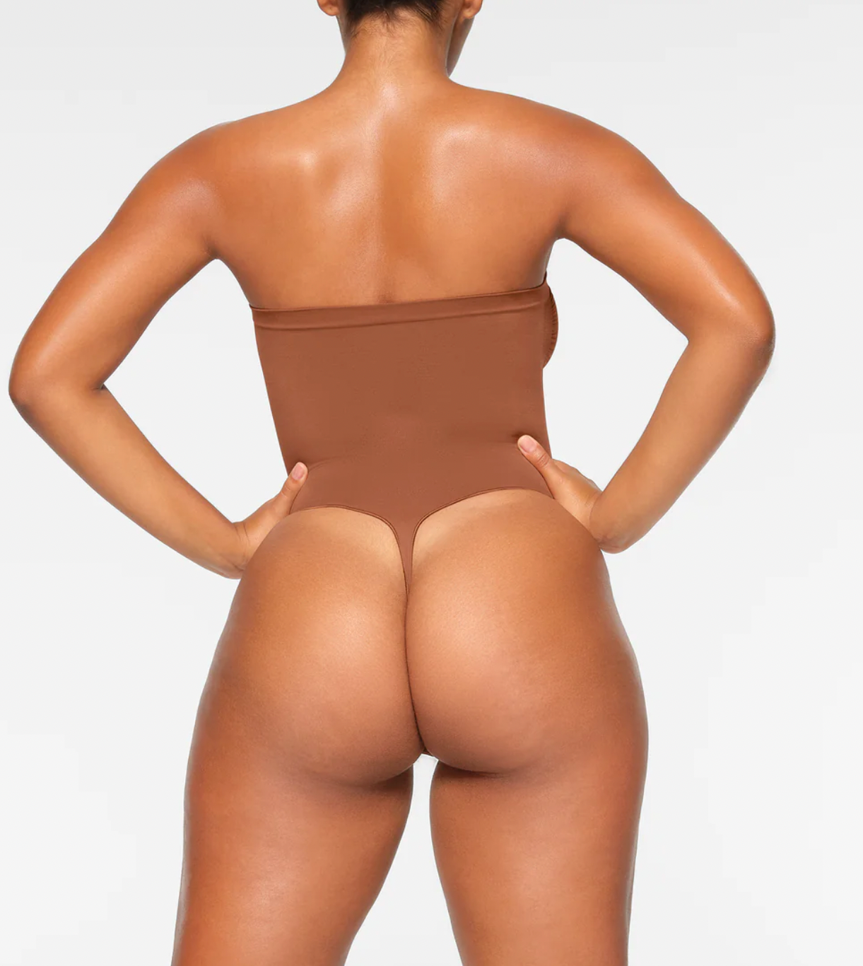 SKIMS Strapless Thong Bodysuit  Seamless Sculpt by Skims Kim Kardashian